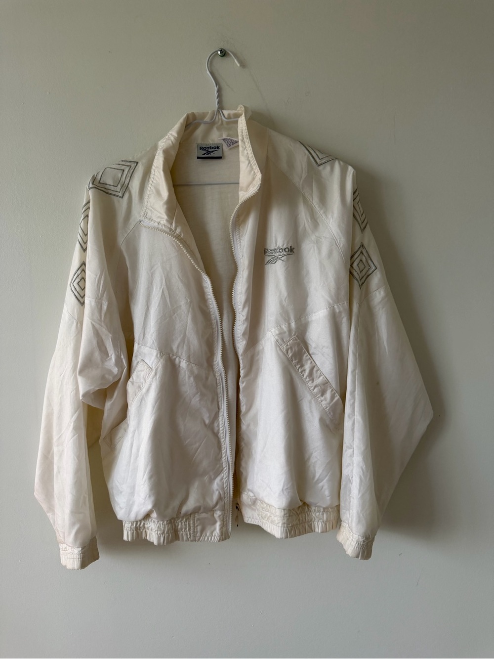 Vintage Reebok Women's Cream Bomber Jacket with Geometric Sleeve Detail